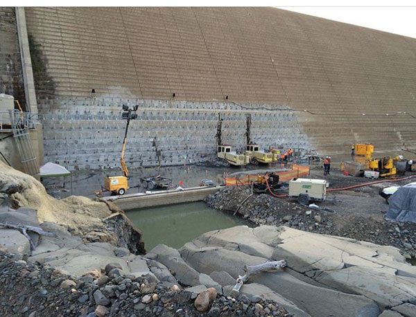 drilling machines working dam wall