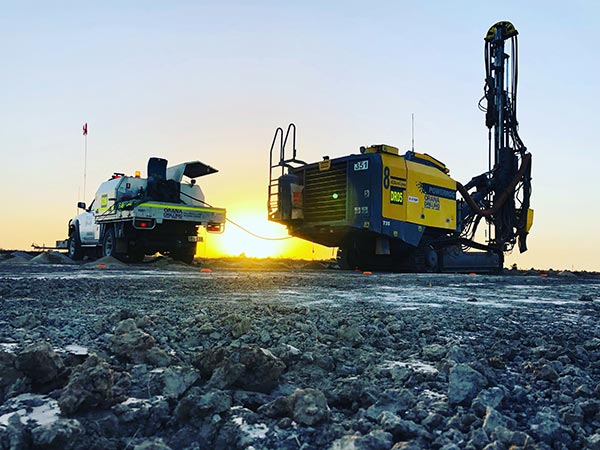 dirlling machine in sunset